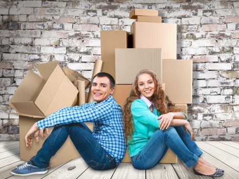 Professional movers loading furniture for a local relocation