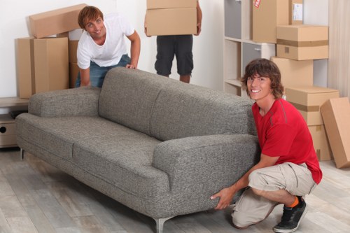 House removals team handling furniture carefully during an Oldcoulsdon move